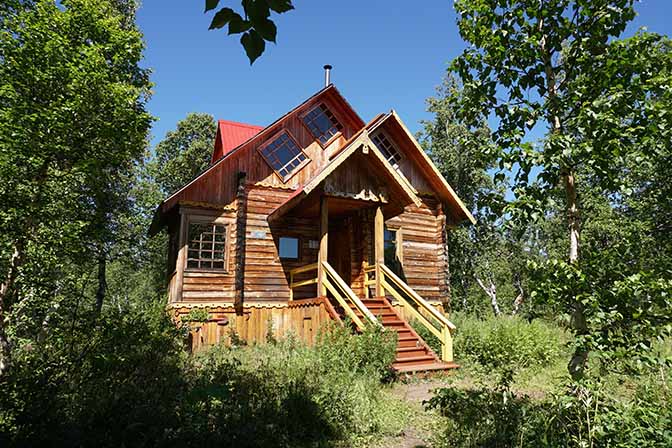 A wooden lodge in the central camp of Nalychevo Park, 2016