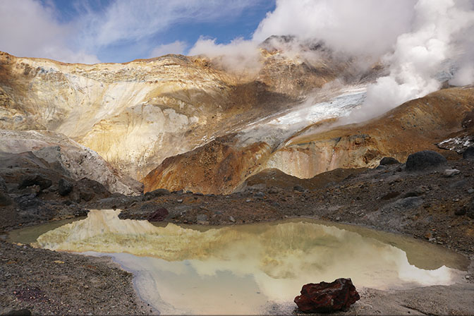 The colorful and steamy caldera of Mutnovsky active volcano, 2016