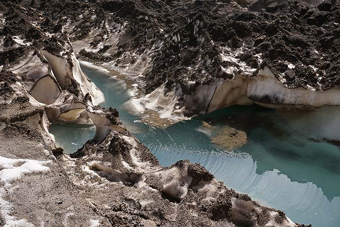 Ash, ice and water in the lake at the bottom of Mutnovski Volcano's caldera, 2016