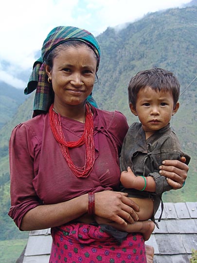 Carrying the Young on the way between Kenja and Sete, along the Khumbu Trail to the Everest, Nepal 2004