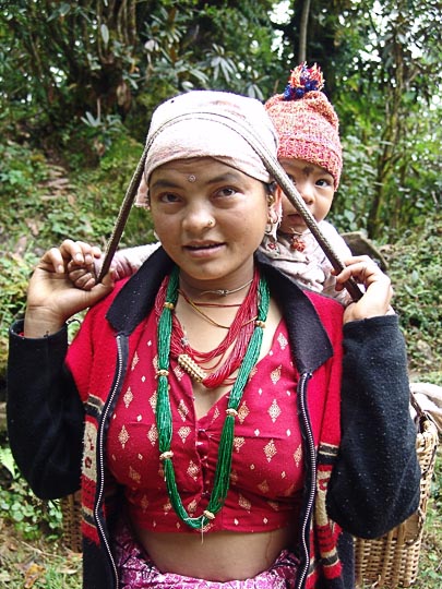 Inside a basket carried on the forehead, on the way between Shivalaya and Deurali, along the Khumbu Trail to the Everest, Nepal 2004