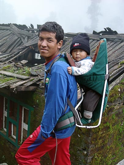 In a baby carrier, on the way between Bupsa and Surke, along the Khumbu Trail to the Everest, Nepal 2004