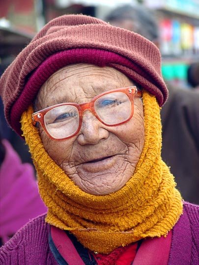 A portrait of a Tibetan woman on pilgrimage along the Lingkor around the Jokhang, Lhasa, Tibet, China 2004