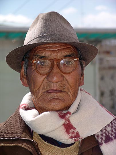 A Tibetan man on pilgrimage along the Lingkor around the Chakpori, Lhasa, Tibet, China 2004