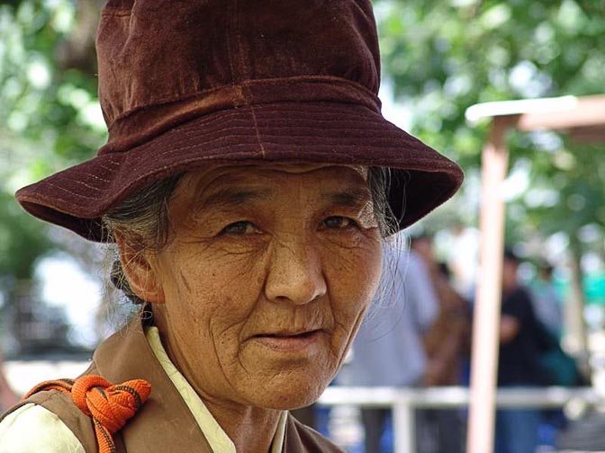 A Tibetan woman at The Dalai Lama birthday ceremony, in the Temple in McLeod Ganj, Dharamsala, India 2004