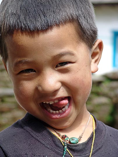 A Nepali kid on the way from Kenja to Sete, along the Khumbu Trail to the Everest, Nepal 2004