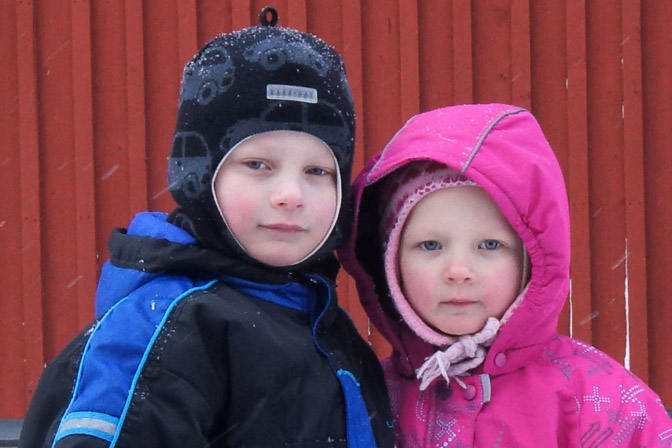 Kids, the LumiLinna Snow Castle of Kemi by the Gulf of Bothnia, the Baltic Sea, Finland 2012