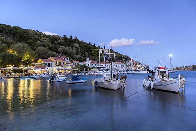 The moon rises after sunset in the port of Kalamos, Kalamos Island 2017