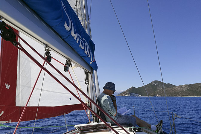 Our skipper, Zeevi, takes a break on the yacht's deck, 2017