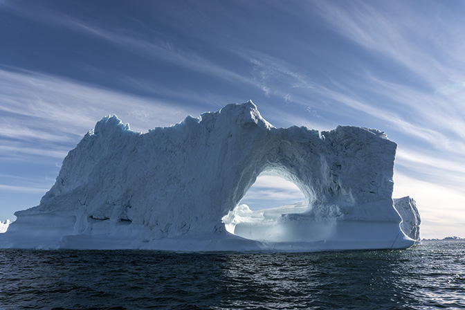 Illuminated sky through a melting hole in a floating iceberg, 2017