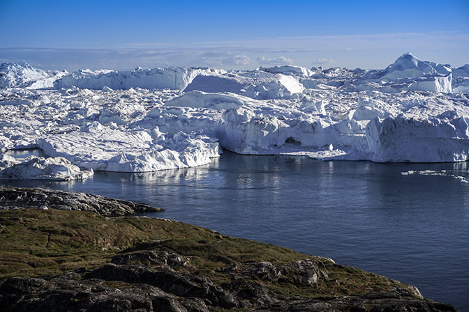 Icebergs drifting in the blue waters of Ilulissat's Icefjord, 2017