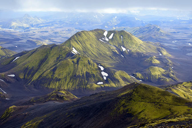 Green moss covered volcanic hills, on the descend from Sveinstindur mountain, 2012