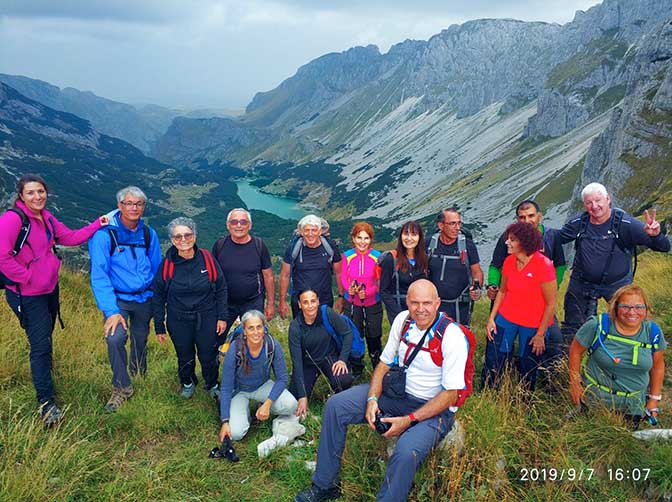Together with the voyage members at the foot of the Bobotov Kuk in the background of Shkrchko Lake, Durmitor Mountains 2019