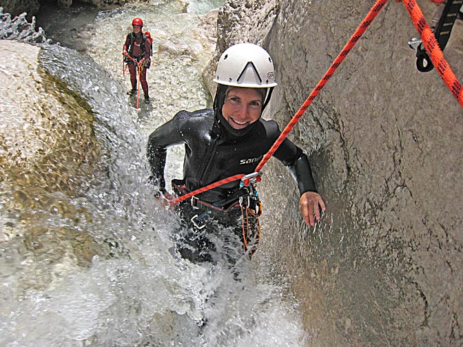 Me, rappelling (abseiling) a wild waterfall in the Mlinarica River, 2007 (photographed by Urban Herzog)