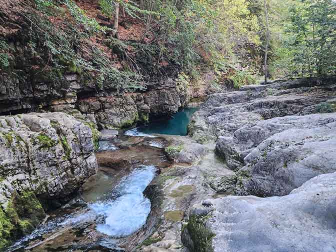A waterfall and a blue pool in Anisclo Canyon, Aragon 2023