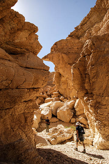 Gadi and Liam in Racham sediment-filled water pits, The Israel National Trail 2009