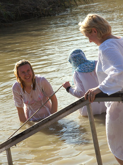 Pilgrims immersing in the Jordan River and smiling happily, the Baptismal Site Qasir alYahud 2012
