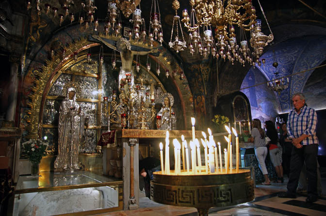 People waiting their turn to pray in the Greek altar at Calvary, or Golgotha, inside the church of the Holy Sepulchre, The Old City 2011