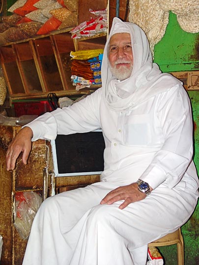 An Arabic man in front of a market shop, The Old City 2006