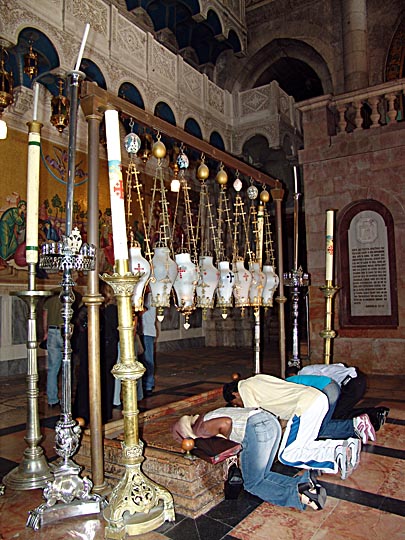 People praying by the Stone of the Anointing (Unction), at the Church of the Holy Sepulchre (the Church of the Resurrection), The Old City 2006