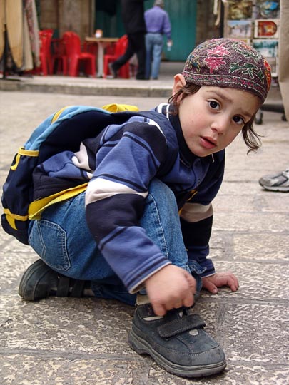 A Jewish kid on his way back from school, in an old city alley, 2006