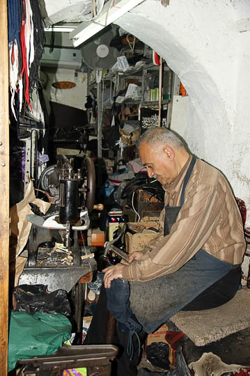 A shoemaker in a cubby in the market, The Old City 2010