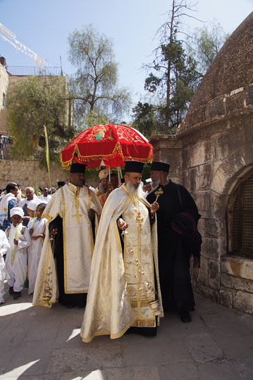 Ethiopian clergymen circle a structure in Deir al Sultan, on the roof of the Chapel of St. Helena of the Holy Sepulcher, Jerusalem 2012