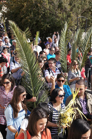Pilgrims raising palm branches in the Catholic and Protestant procession, Mount of Olives 2012