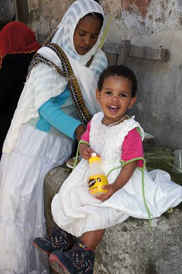 Sweet Ethiopian girl in a party dress, in the Ethiopian village of Deir al Sultan, Jerusalem 2012