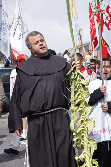 Franciscan monk carrying a braided palm branch in the Catholic and Protestant procession, Mount of Olives  2012