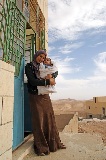 Sara and Muhammad, Bedouins, in front of their house, Umm Al-Kheir 2010