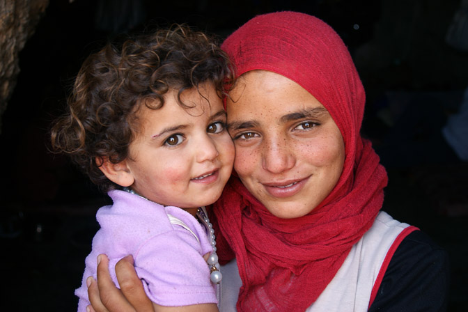 Hiba and Fatma, Palestinian girls at the entrance to their home-cave, Al-Mufaqara 2011