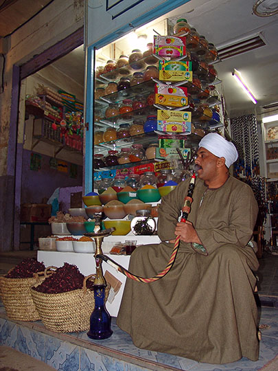 A local merchant smoking Nargila in a local Suq (street market), Luxor 2006