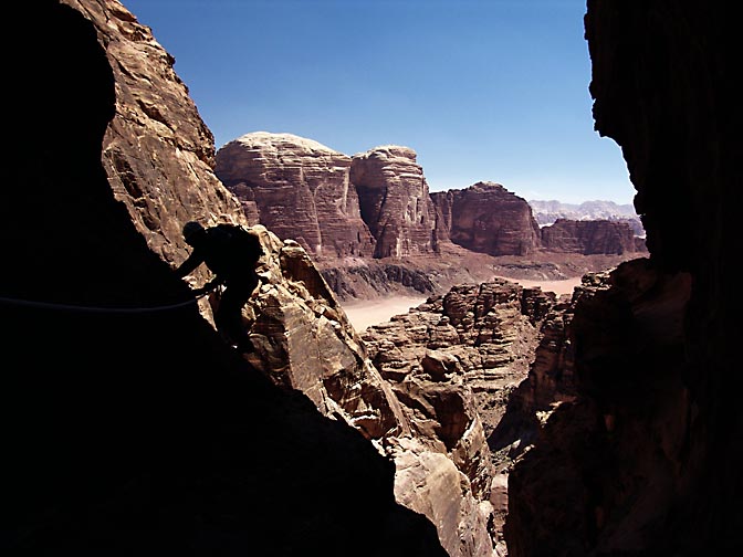 A silhouette and the colorful view on the descent from Jabel Rum, 2005