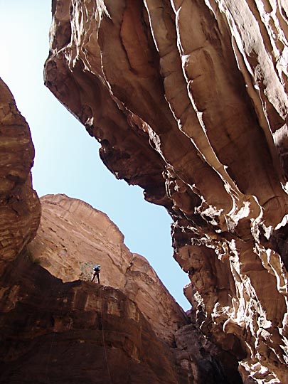 Micha rappels (abseils) down the mighty cliffs of Jabel Rum, 2005