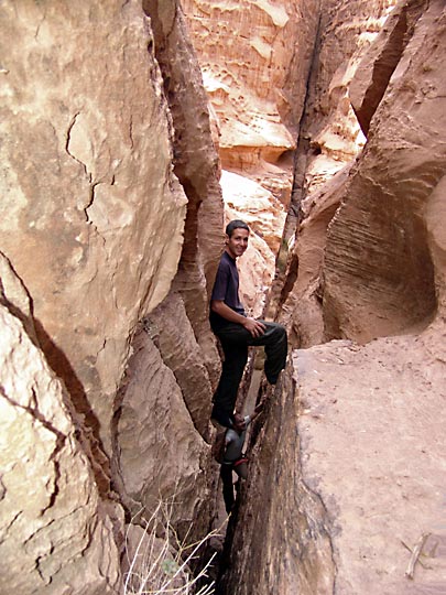 Aviv and Francois climbing up a narrow crack in the Mohammed Musa Route in Jabel Um Ishrin, 2006