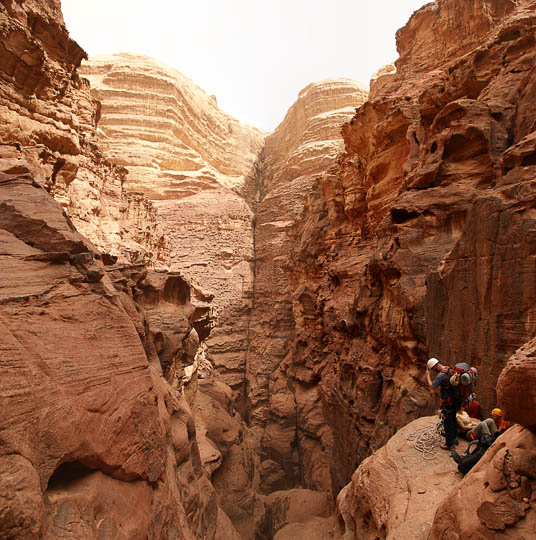 Akel preparing to rappel (abseil) into the gorge of Jabel Khazali, 2009