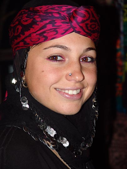 A beautiful young woman in a traditional head cover, in a restaurant in Yukari Kavron, 2005