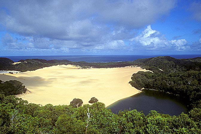 A sandblow damming the deep green waters of lake Wabby, Fraser Island, Queensland 2000