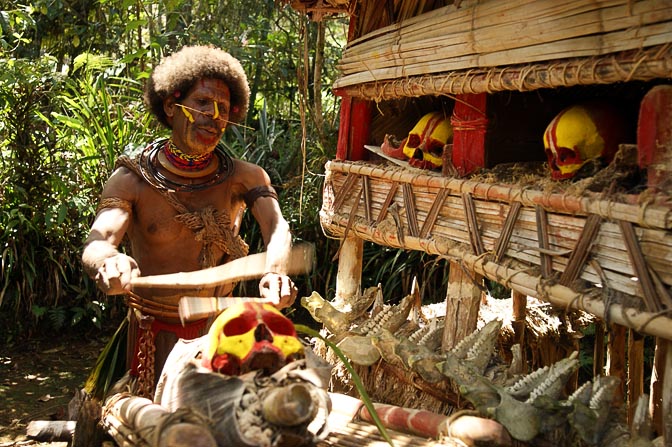 A Huli Tribe Fortune Teller is performing a ritual with his ancestors' skulls, Tari 2009