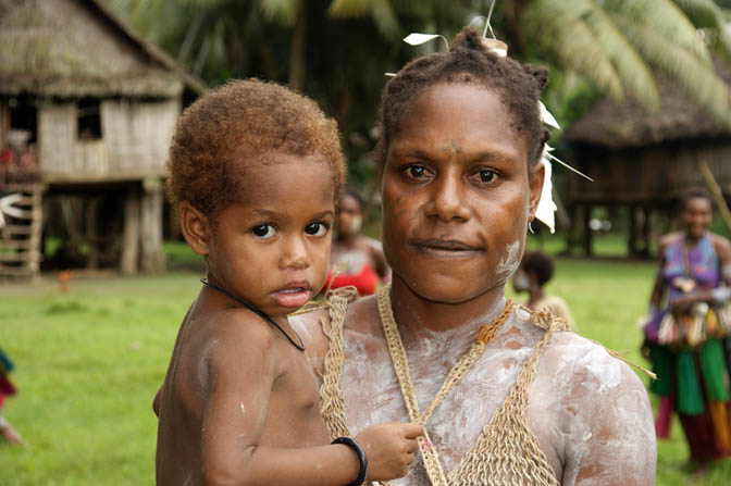 A mother carrying her girl in Kararau, the Sepik River 2009