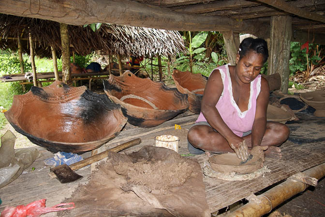 A potter forms a clay oven in Aibom, the Sepik River 2009