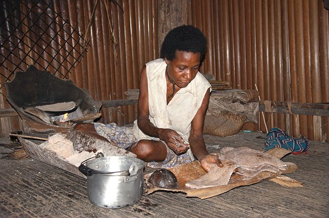 Sago pancake preparation in a clay oven in Yamok, the Sepik River 2009