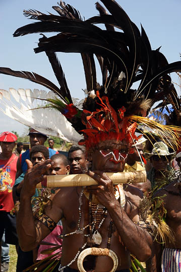 A man from Goroka in the Eastern Highland Province, playing a bamboo flute at The Wewak Garamut and Mambu Festival 2009