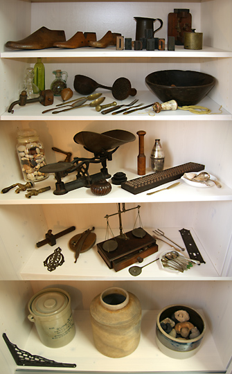 Collage of the left side of the display closet with the special collection, 2009