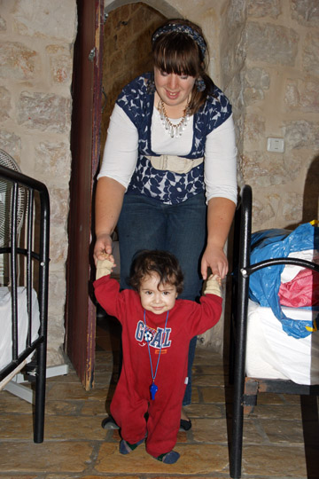  Loni, an American volunteer in 'Shevet Achim' House, is playing with Dina from Iraqi Kurdistan, Jerusalem 2011